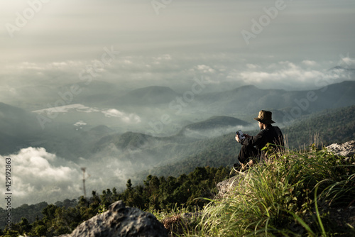 Fototapeta a man sitting and looking away to nature scenic view from viewpoint of Khao Luan