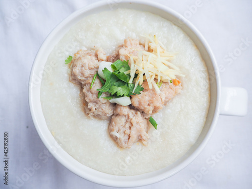 Top view of Rice porridge with minced pork, sliced ginger