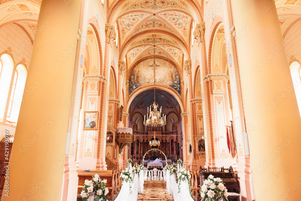 A large beautiful church is decorated for the wedding ceremony of the newlyweds, Belogruda, April 2021