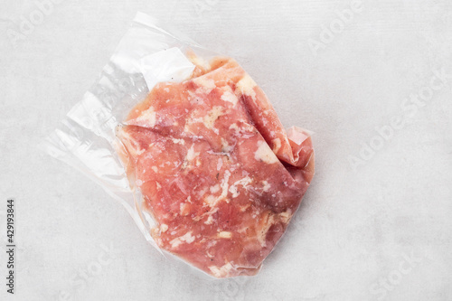 frozen chicken fillet with spices in vacuum packaging, ready food delivery, food storage