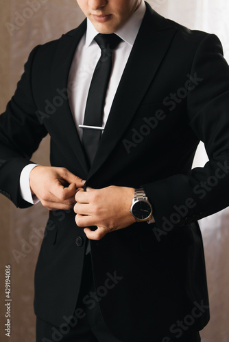 wedding photo, male groom buttons up jacket, male suit © ksyusha_yanovich