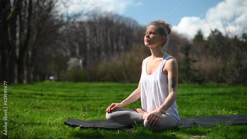Yoga practice and meditation outdoor. Girl in the park Yoga practice and meditation outdoor. Girl in the park