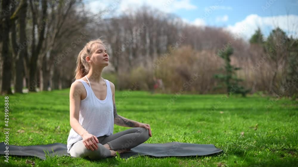 Yoga practice and meditation outdoor. Girl in the park Yoga practice and meditation outdoor. Girl in the park