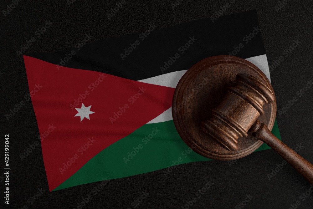 Judges gavel and the flag of Jordan. Law and Justice. Constitutional law