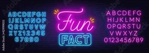 Fun Fact neon sign on brick wall background.