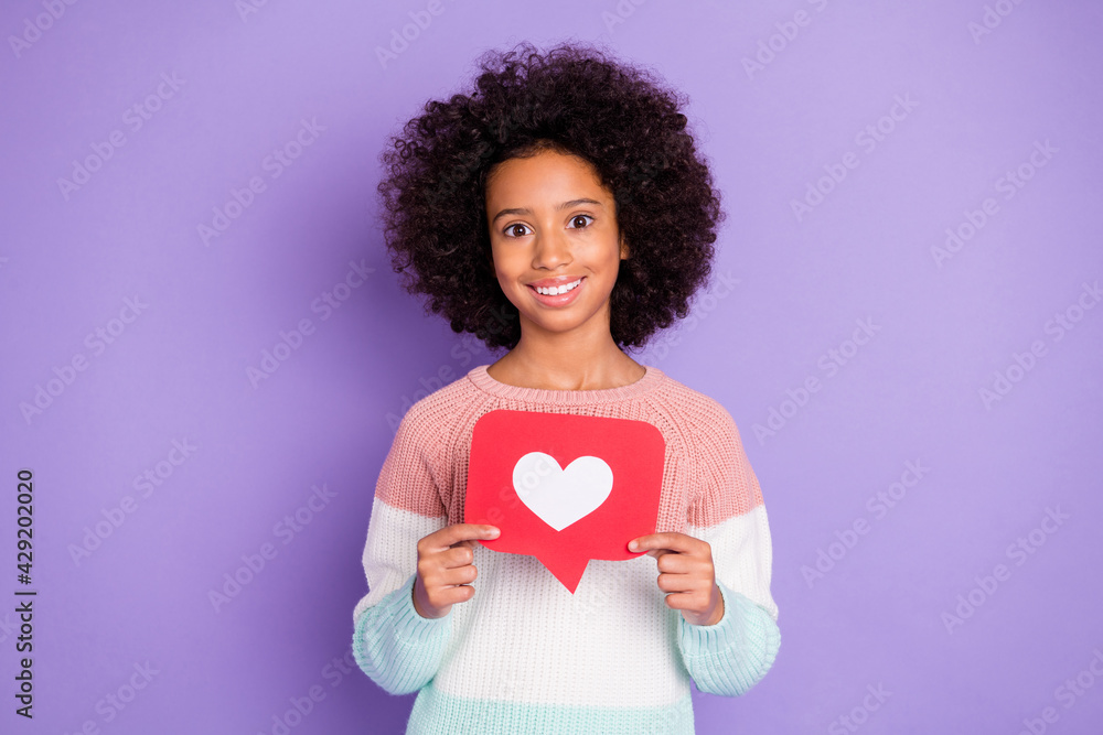 Portrait of optimistic curly hairdo girl hold like wear white sweater isolated on violet background Portrait of optimistic curly hairdo girl hold like wear white sweater isolated on violet background