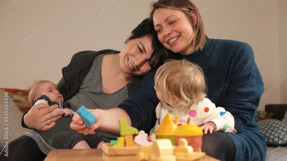 Happy LGBT family. Portrait of a same-sex married couple with children. Lesbian parenting. Happy LGBT family. Portrait of a same-sex married couple with children. Lesbian parenting.