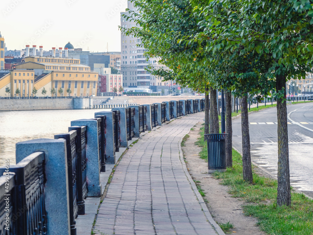 Morning empty granite embankment in Moscow