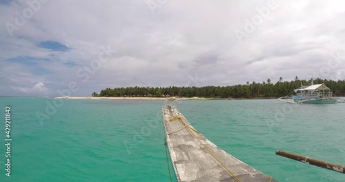 First person view from a boat of magnificent Siargao island, Philippines. Turquoise clear water and breath-taking views.