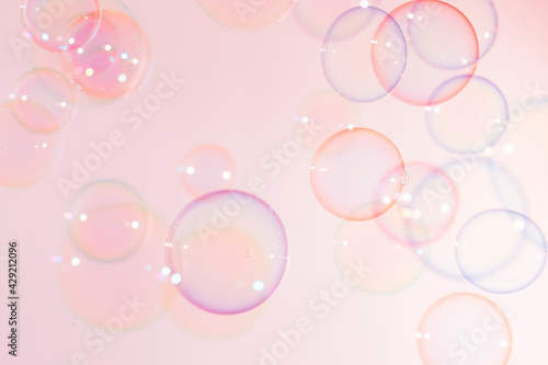 Colorful Transparent Pink soap Bubbles Float Background. © Siwakorn1933