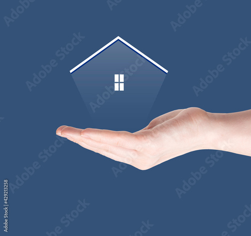 Woman hand hold a transparent home model on sunlight  Saving for buy a new house or real estate and loan for plan business investment concept.