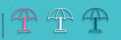Paper cut Sun protective umbrella for beach icon isolated on blue background. Large parasol for outdoor space. Beach umbrella. Paper art style. Vector