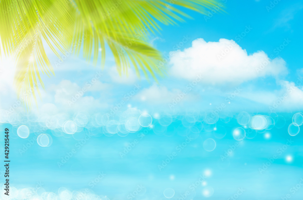 Blur beautiful nature green palm leaf on tropical beach with bokeh sun light wave abstract background. Blur beautiful nature green palm leaf on tropical beach with bokeh sun light wave abstract background.