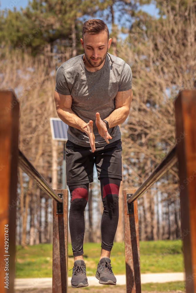 Fototapeta premium Man working out in street workout park