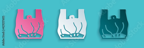 Paper cut Say no to plastic bags poster icon isolated on blue background. Disposable cellophane and polythene package prohibition sign. Paper art style. Vector