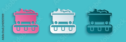 Paper cut Coal train wagon icon isolated on blue background. Rail transportation. Paper art style. Vector