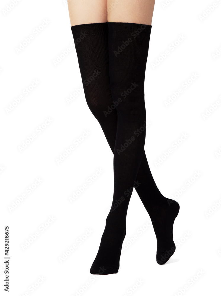 Legs of sexy young caucasian woman in cotton tights on white background