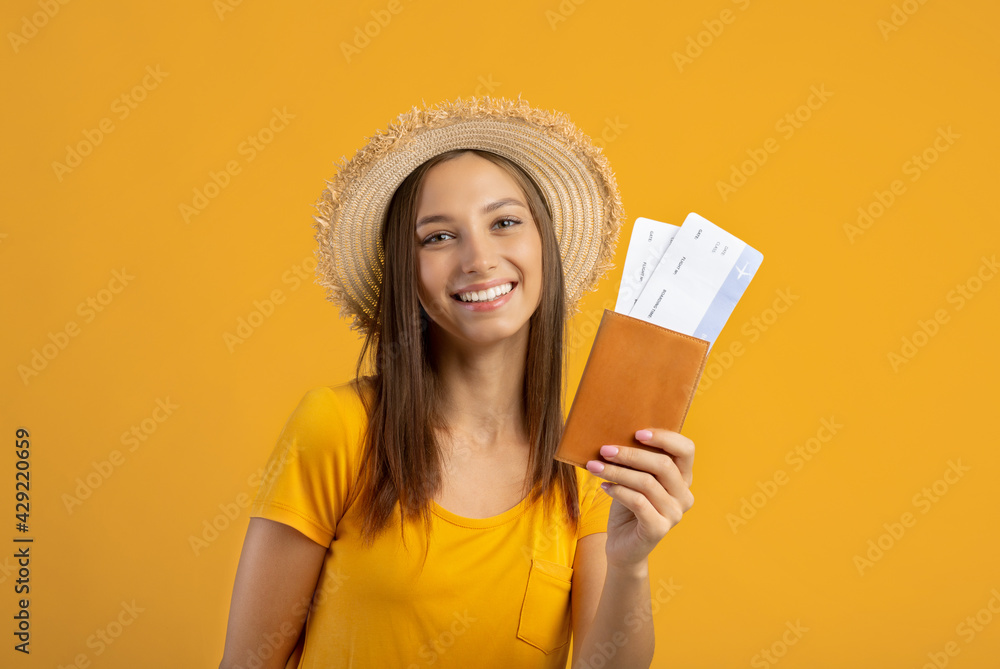 Happy woman tourist with passport and flight tickets Happy woman tourist with passport and flight tickets