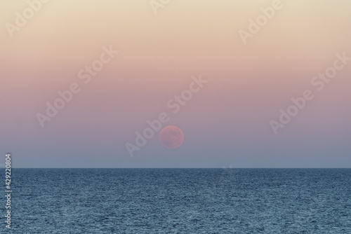 Moonrise over sea