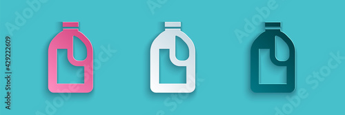 Paper cut Plastic bottle for laundry detergent, bleach, dishwashing liquid or another cleaning agent icon isolated on blue background. Paper art style. Vector