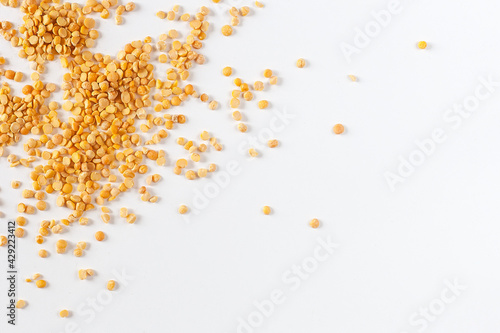 Yellow split peas isolated on white background.