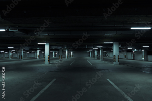 Horizontal image of dark underground parking lot