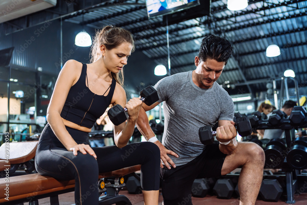 Coaching Woman Basic Workout Exercise in Fitness Gym Weight Training Healthy Lifestyle bodybuilding, Athlete doing Deadlift with barbell for builder muscles sportive. Coaching Woman Basic Workout Exercise in Fitness Gym Weight Training Healthy Lifestyle bodybuilding, Athlete doing Deadlift with barbell for builder muscles sportive.