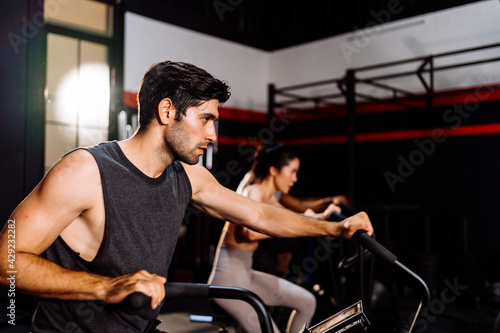 Athlete Sporty Group Cardio Exercise Burning Calorie in Fitness Gym Fit Body Healthy Lifestyle Athlete Muscle Building Strong Endurance in Health Club. © Kiattisak