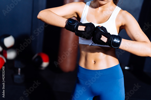 Endurance Boxer Woman Ready Fight Boxing Exercise Workout Fit Body Healthy Lifestyle Athlete Muscle Building Strong in Fitneess Gym Health Club. © Kiattisak