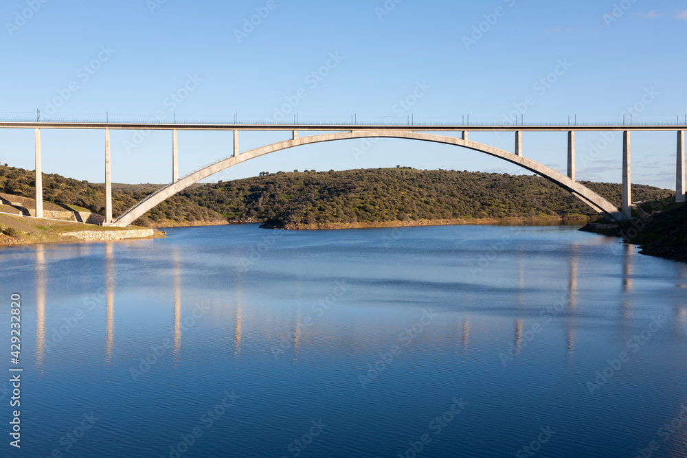 Obraz premium Viaduct or bridge of the AVE high-speed train over the Almonte river in Caceres, Extremadura. Madrid - Extremadura line.