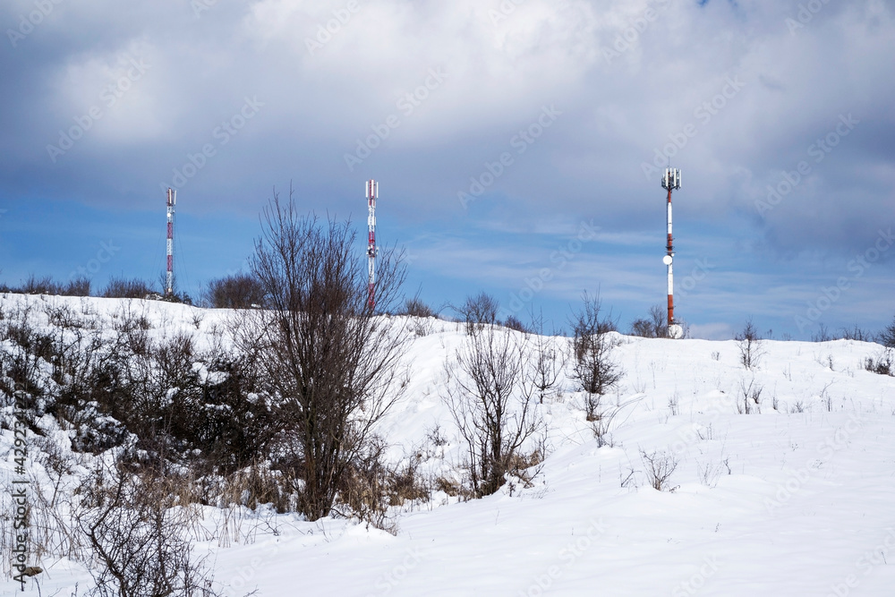Communication tower antenna, winter landscape. Racos , Brasov county, Romania. Communication tower antenna, winter landscape. Racos , Brasov county, Romania.