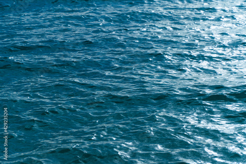 A deep blue sea surface. Nature calm ocean ripple. Water wave texture for background.