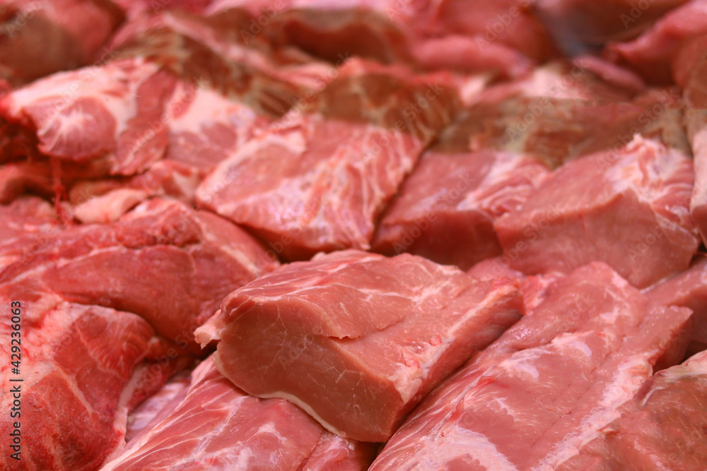 fresh raw boneless pork shoulder butt slices. Top view.