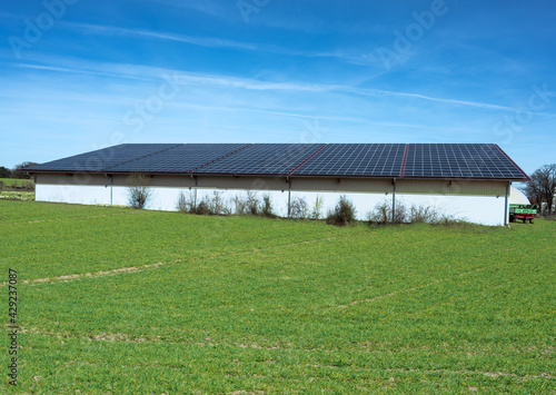 Green Energy with Solar Collectors - building modified by image editing