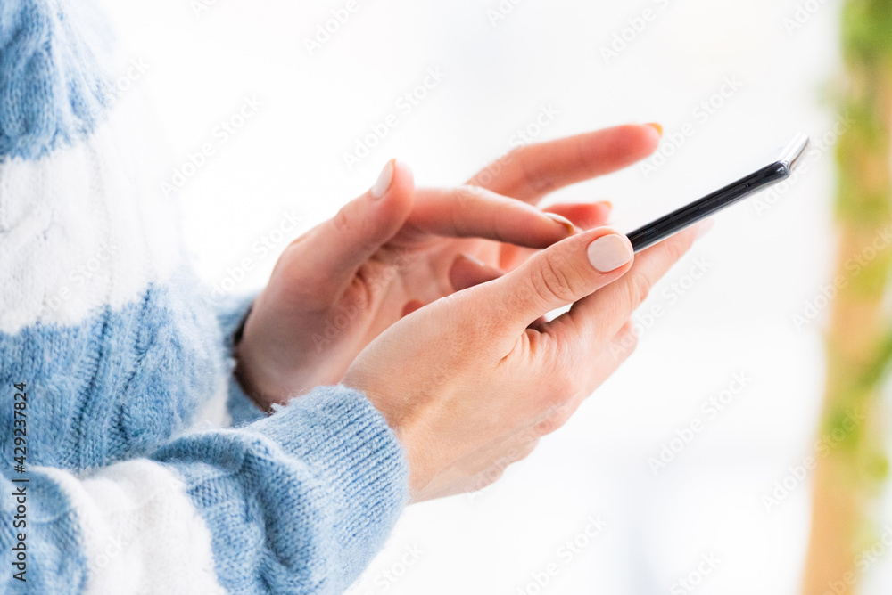 Female hands using mobile phone close up Female hands using mobile phone close up