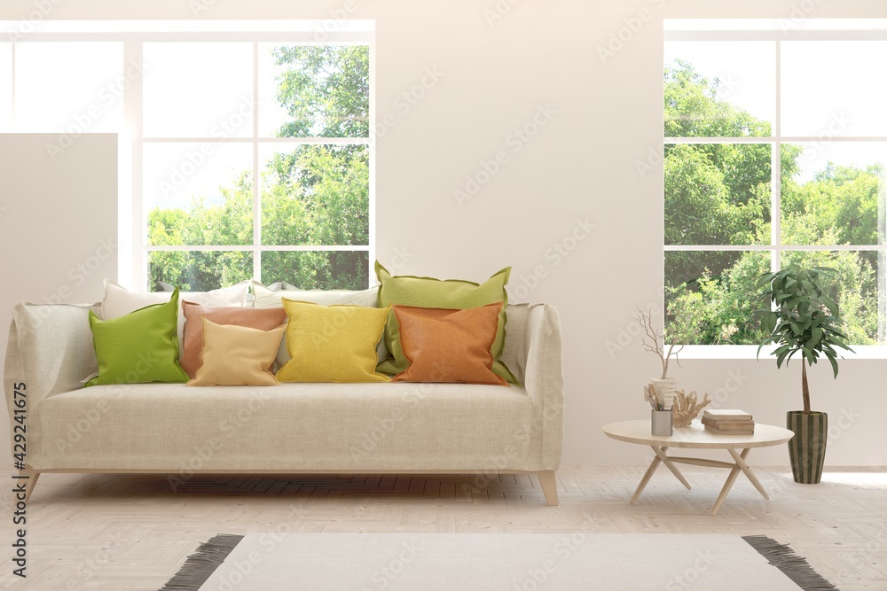 Fototapeta premium White living room with sofa and summer landscape in window. Scandinavian interior design. 3D illustration