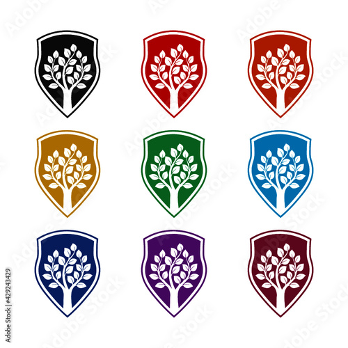 Shield with tree isolated on white background color set