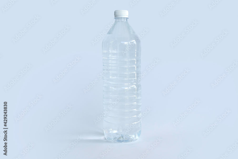 A plastic bottle of drinking water isolated on white background. A plastic bottle of drinking water isolated on white background.