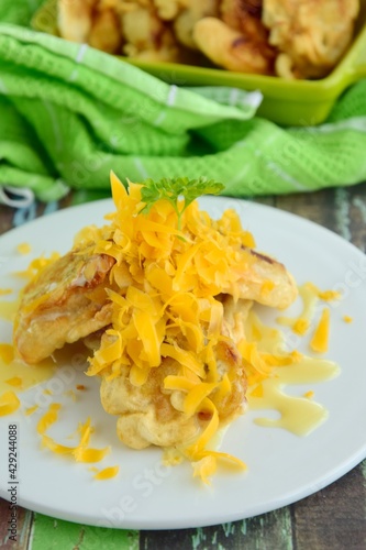 Pisang Goreng or fried banana with grated cheese and condensed milk