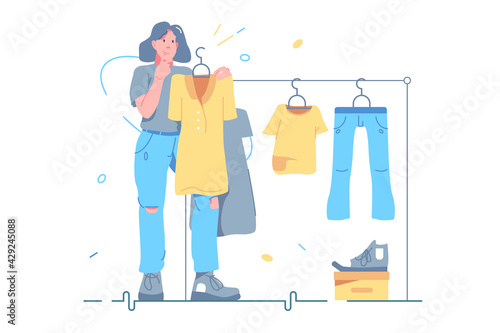 Girl choosing clothes on store