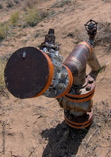 Natural gas oil well head pumped dry and capped as we exhaust fossil fuels and transition to renewable green energy sustainable environmentally friendly.
