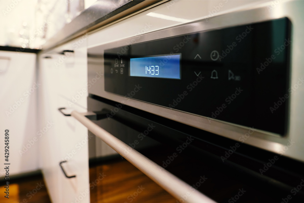 Background, blur, out of focus, bokeh. Electric oven built-in kitchen furniture. Background, blur, out of focus, bokeh. Electric oven built-in kitchen furniture.