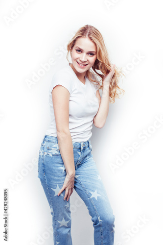 young pretty stylish blond hipster girl posing emotional isolated on white background happy smiling cool smile, lifestyle people concept © iordani