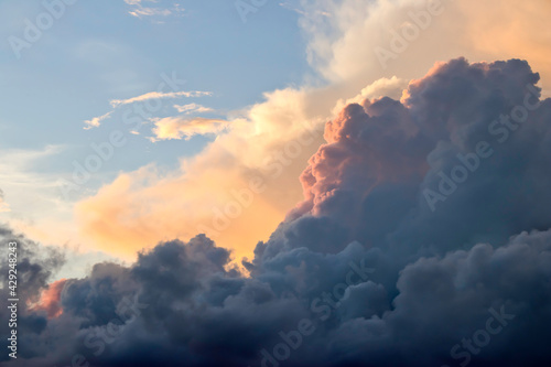 Dramatic morning cloudy sky. Full of cumulonimbus and cumulus clouds in the morning light. © Chumrit