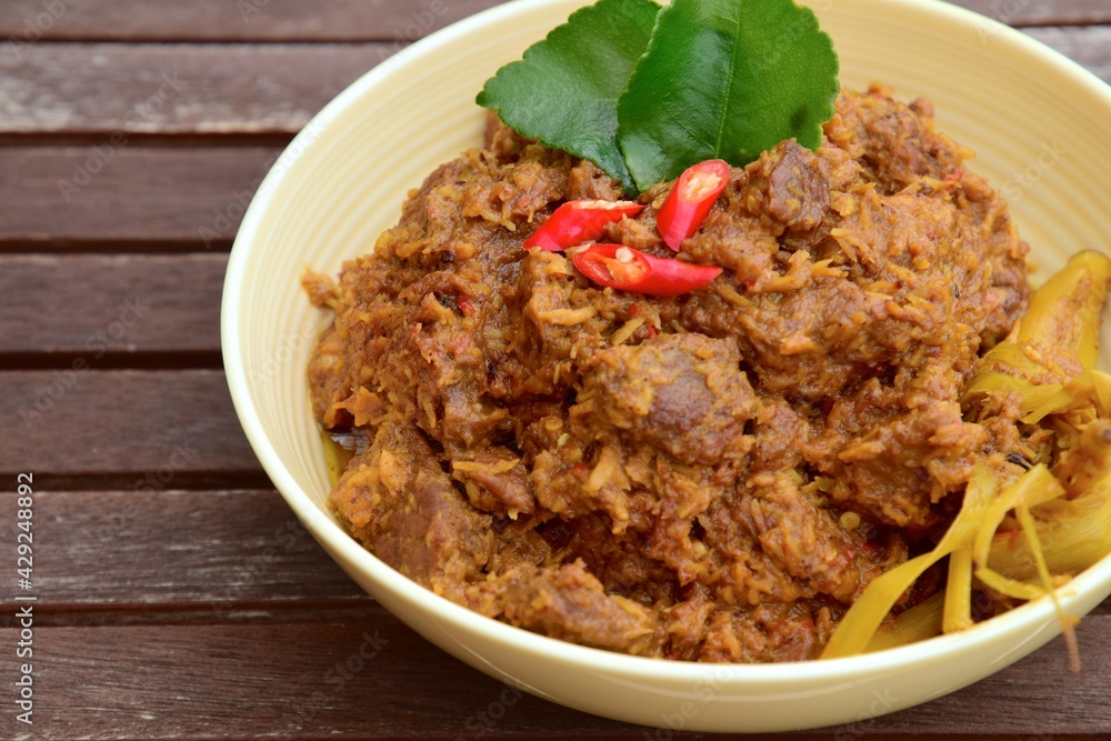Beef Rendang or spicy beef stew. The popular dish from West Sumatran, Indonesia Beef Rendang or spicy beef stew. The popular dish from West Sumatran, Indonesia