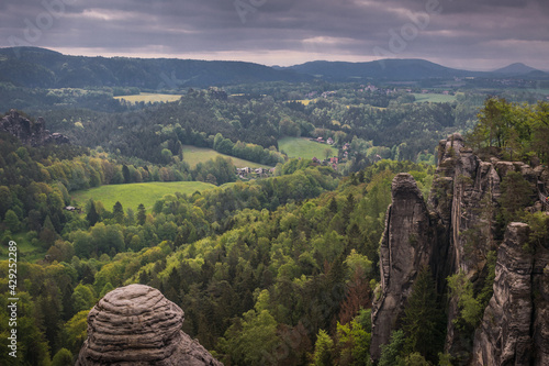 Bild auf Leinwand View from viewpoint of Bastei Bridge in Saxon Switzerland Germany to the town at