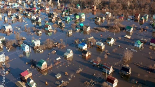 The peak of the spring flood in the village of Bashkortostan. Destroyed outbuildings and flooded cottages. Natural disasters. High quality. 4k footage.