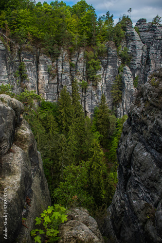 Saxon Switzerland is a unique natural wonder in Saxony, Germany. Sandstone cliffs in green valleys.
