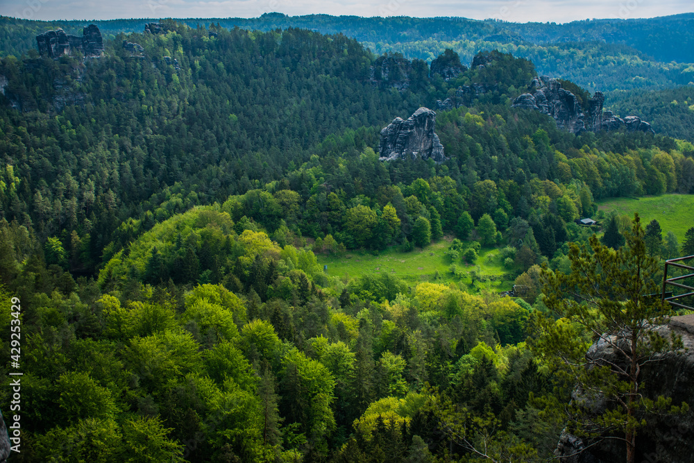 Saxon Switzerland is a unique natural wonder in Saxony, Germany. Sandstone cliffs in green valleys. Saxon Switzerland is a unique natural wonder in Saxony, Germany. Sandstone cliffs in green valleys.