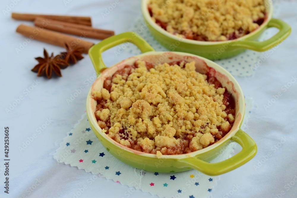 Plum crumble with spices on white background. Summer crispy fruit dessert. Tasty breakfast
Plum crumble with spices on white background. Summer crispy fruit dessert. Tasty breakfast